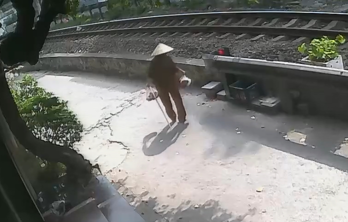 Elderly woman with limited mobility fatally struck by train while crossing tracks - Vietnam
