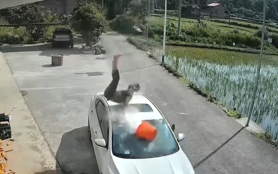 Man falls from 4th floor roof, smashes into car below - China