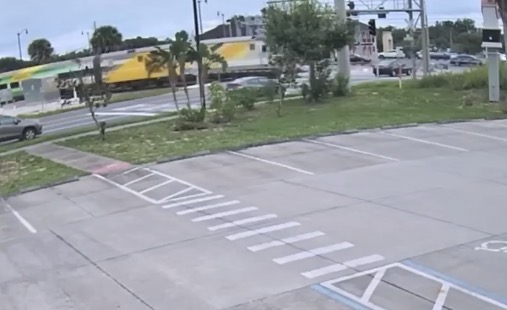 Driver killed after forcing through railroad crossing gate and being struck by oncoming train - Florida