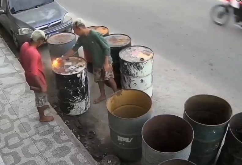 Barrel explosion injures two young men after dangerous experiment is caught on security camera - Brazil