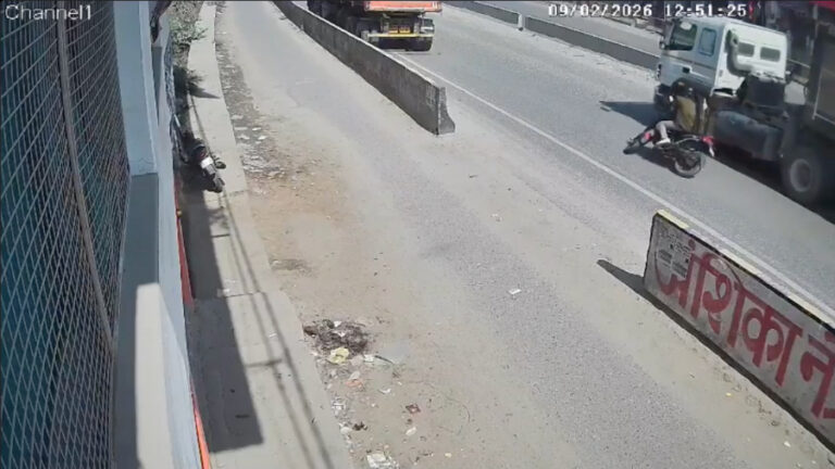 Motorcyclist falls while braking to avoid parked truck, run over by passing vehicle - India