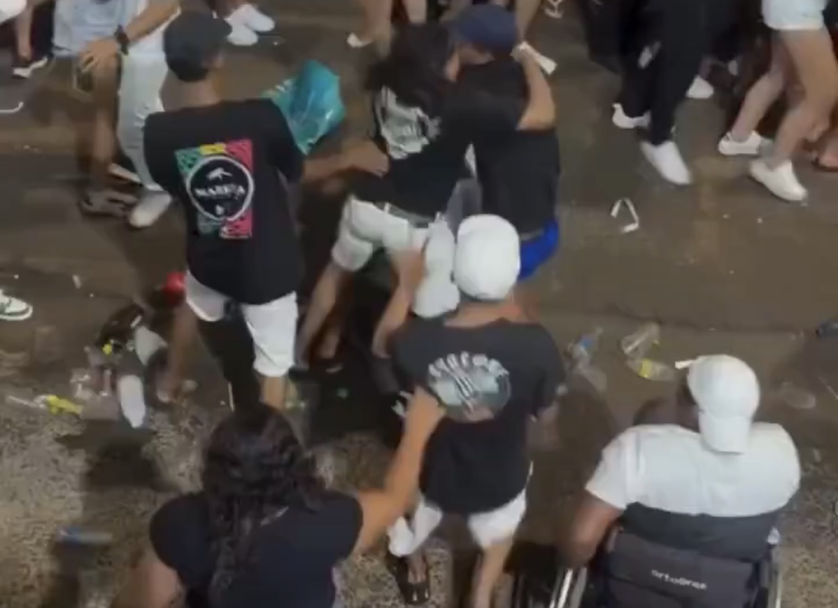 Altercation at carnival escalates between multiple individuals, resulting in a man in a wheelchair being knocked over - Brazil