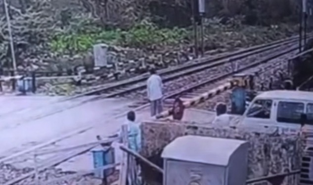 Government official lies on railway tracks moments before oncoming train in incident caught on CCTV - India