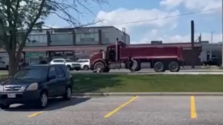 64-year-old woman killed after being struck by a turning dump truck at an intersection - Canada